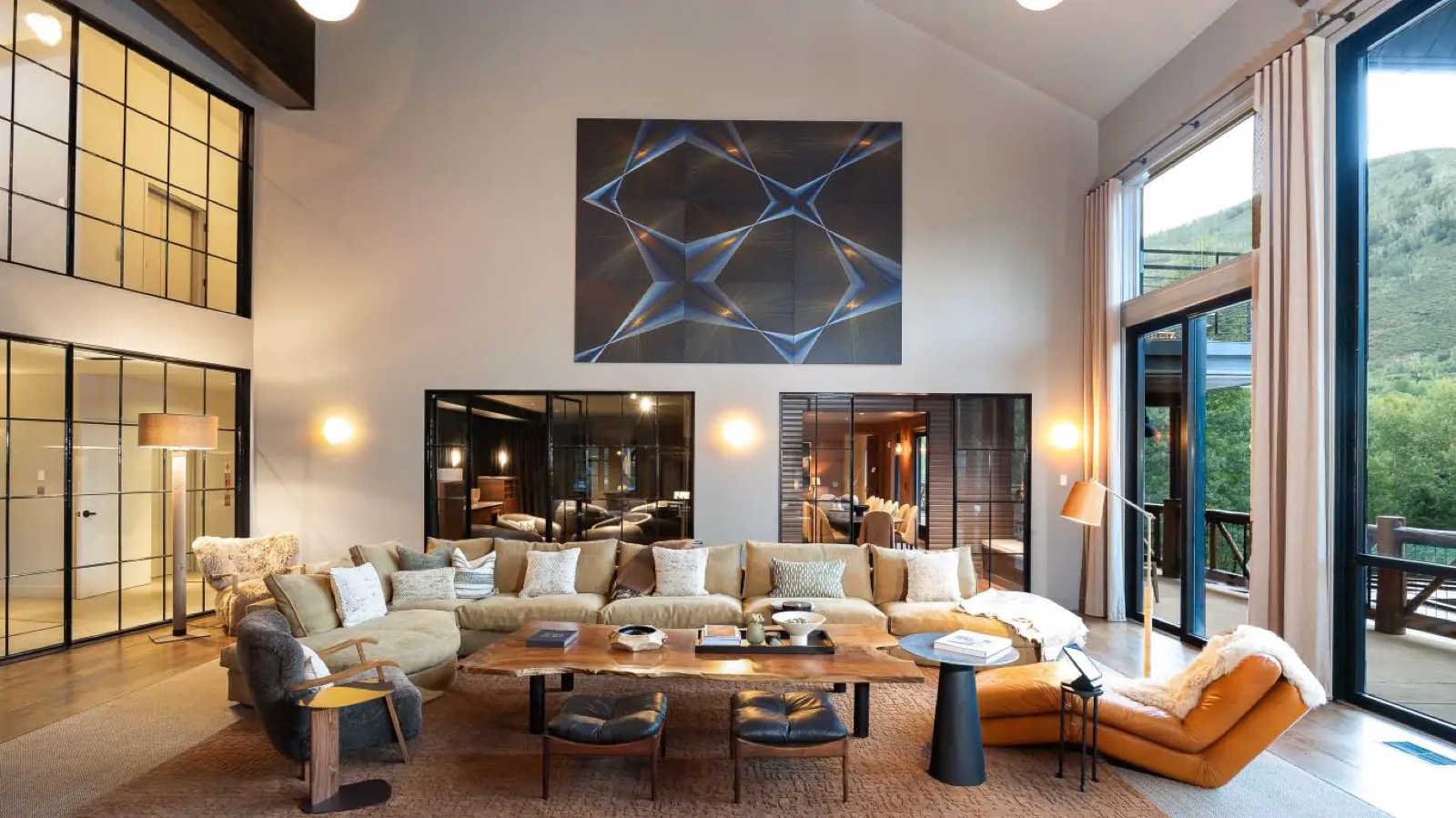 Sectional seating beneath the geometric canvas