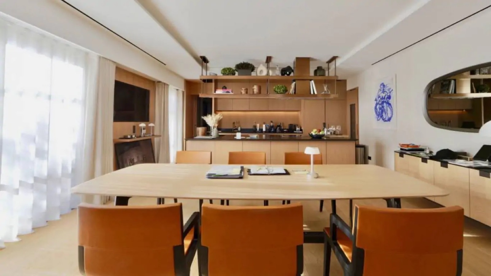 Second dining room with open kitchen behind