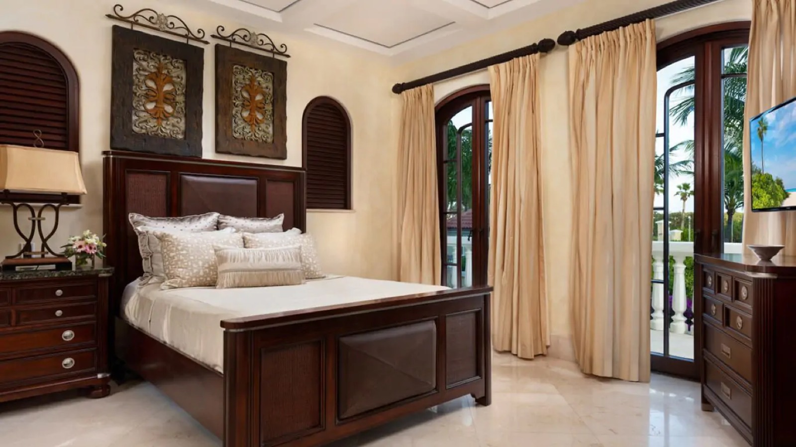 Bedroom with arched doors to the balcony