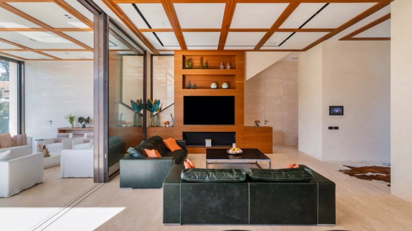 Sitting area with green leather sofas