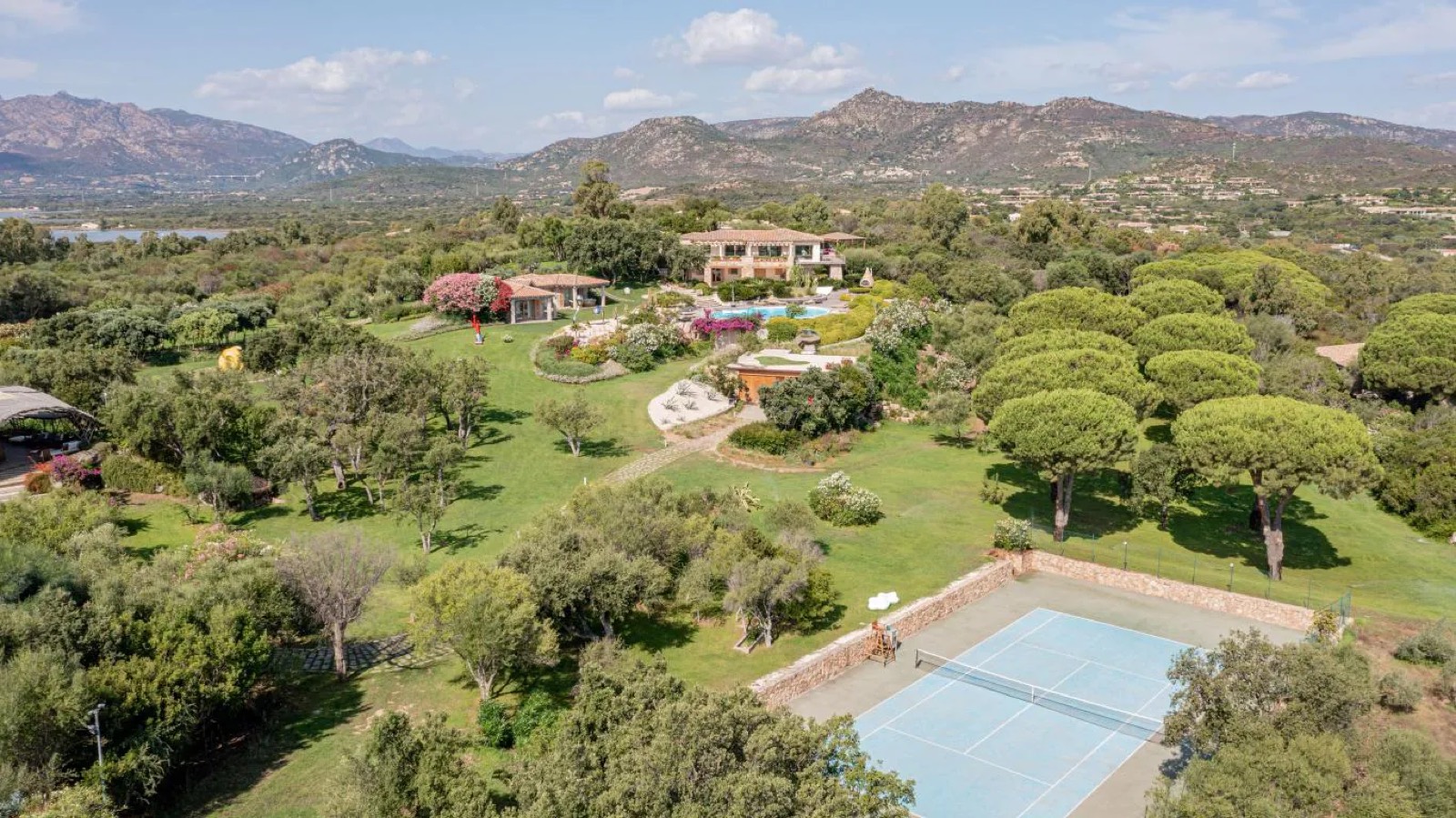 Tennis court and lawns seen from above