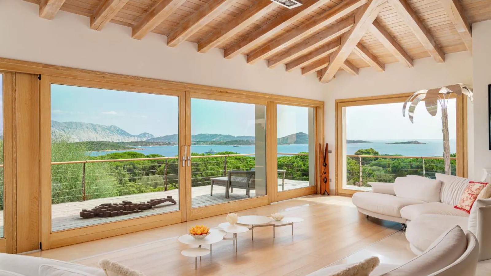 Living room under beamed ceilings facing the sea