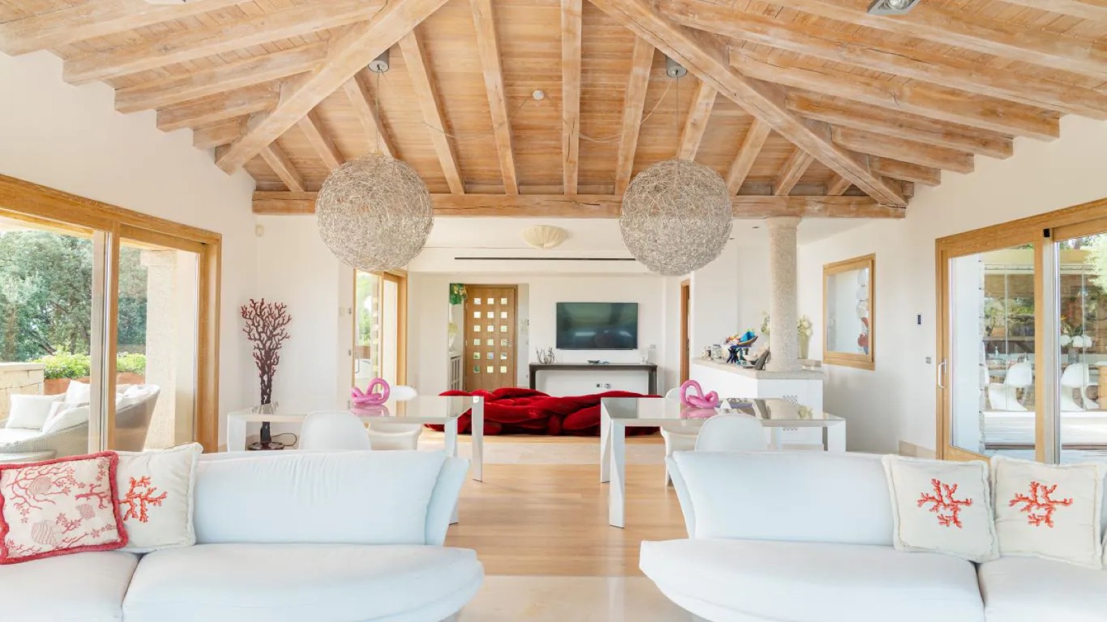 Sitting room with woven globe pendants