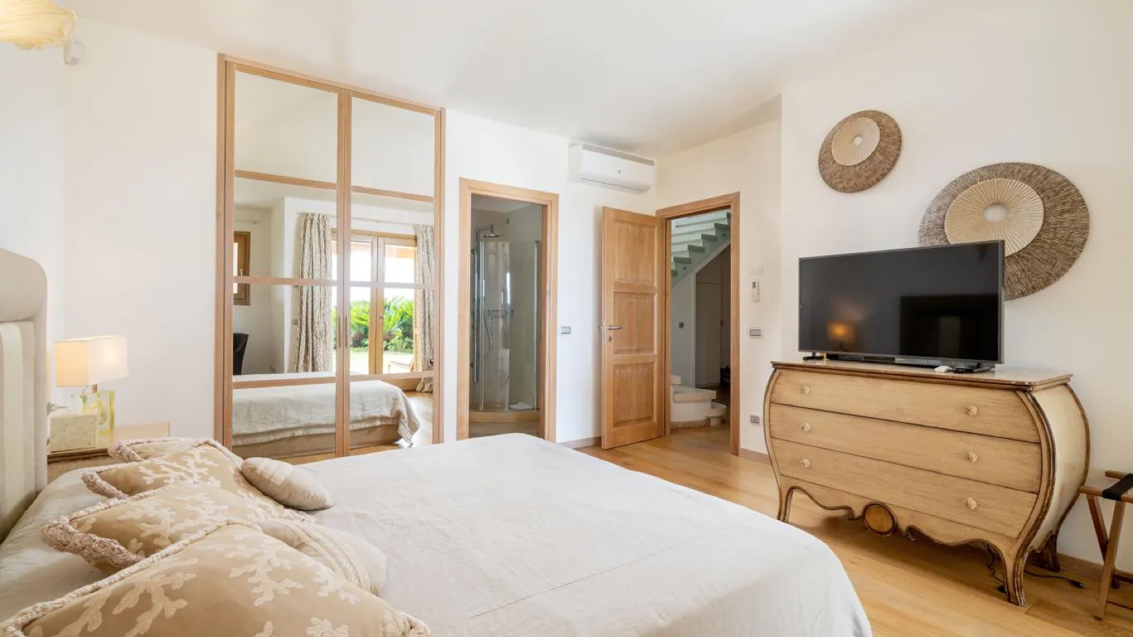 Bedroom with mirrored wardrobes and en suite shower