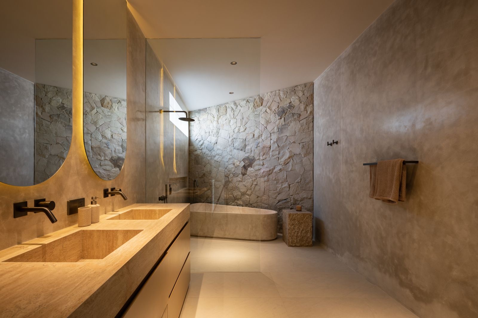 Ensuite bathroom with stone bath and double vanity