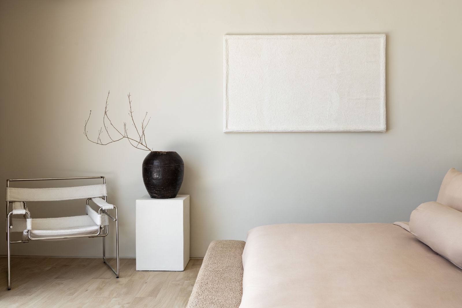Bedroom corner with chrome-framed chair