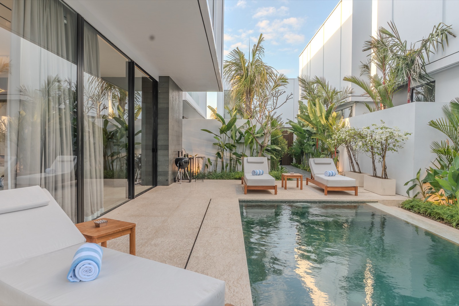 The pool running alongside the planted courtyard wall