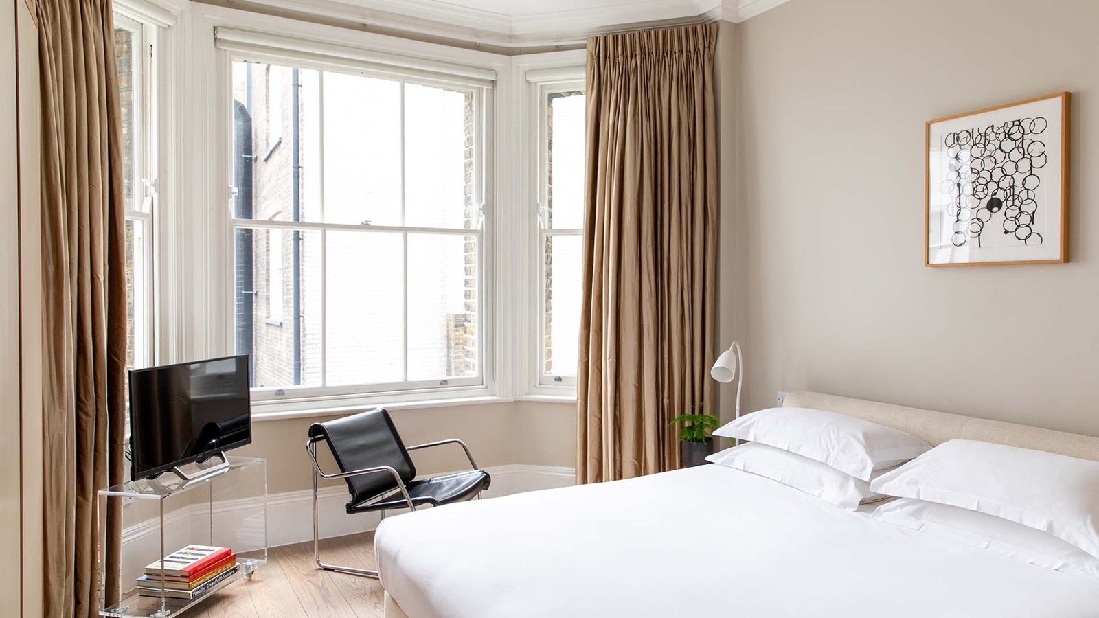 Bedroom with super-king bed and bay window