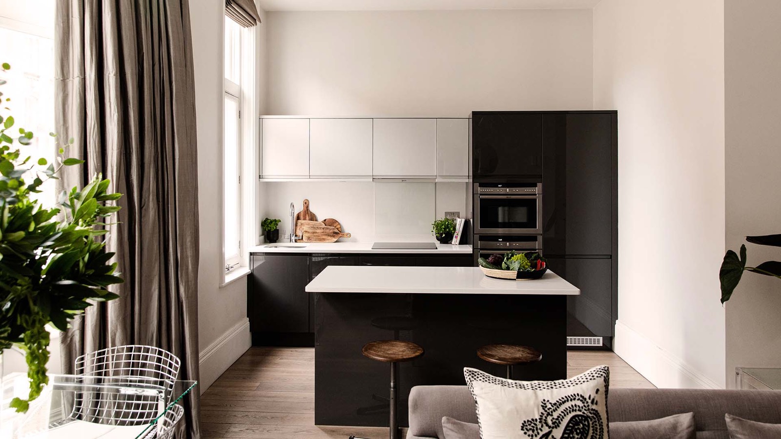 Kitchen with island and wooden bar stools