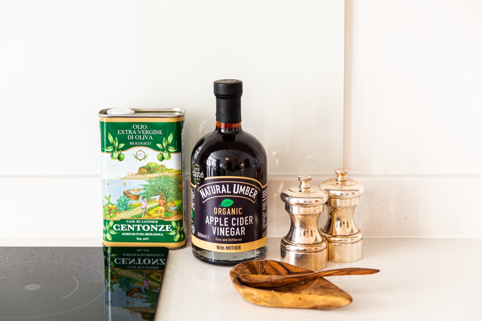 Olive oil and pepper mills on the worktop