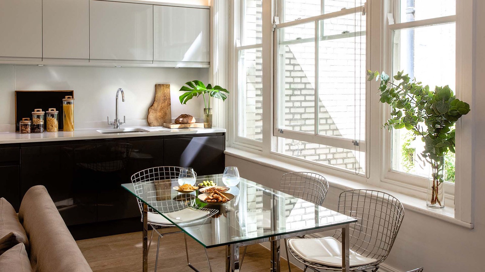 Glass dining table with wire chairs