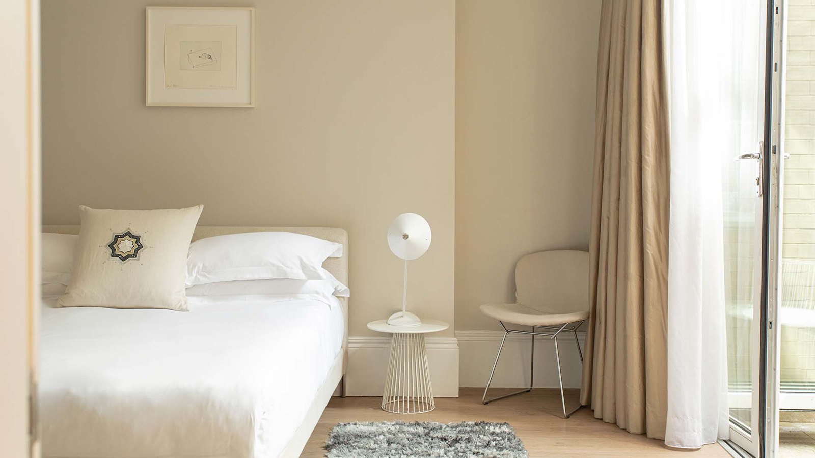 Principal bedroom with a reading chair
