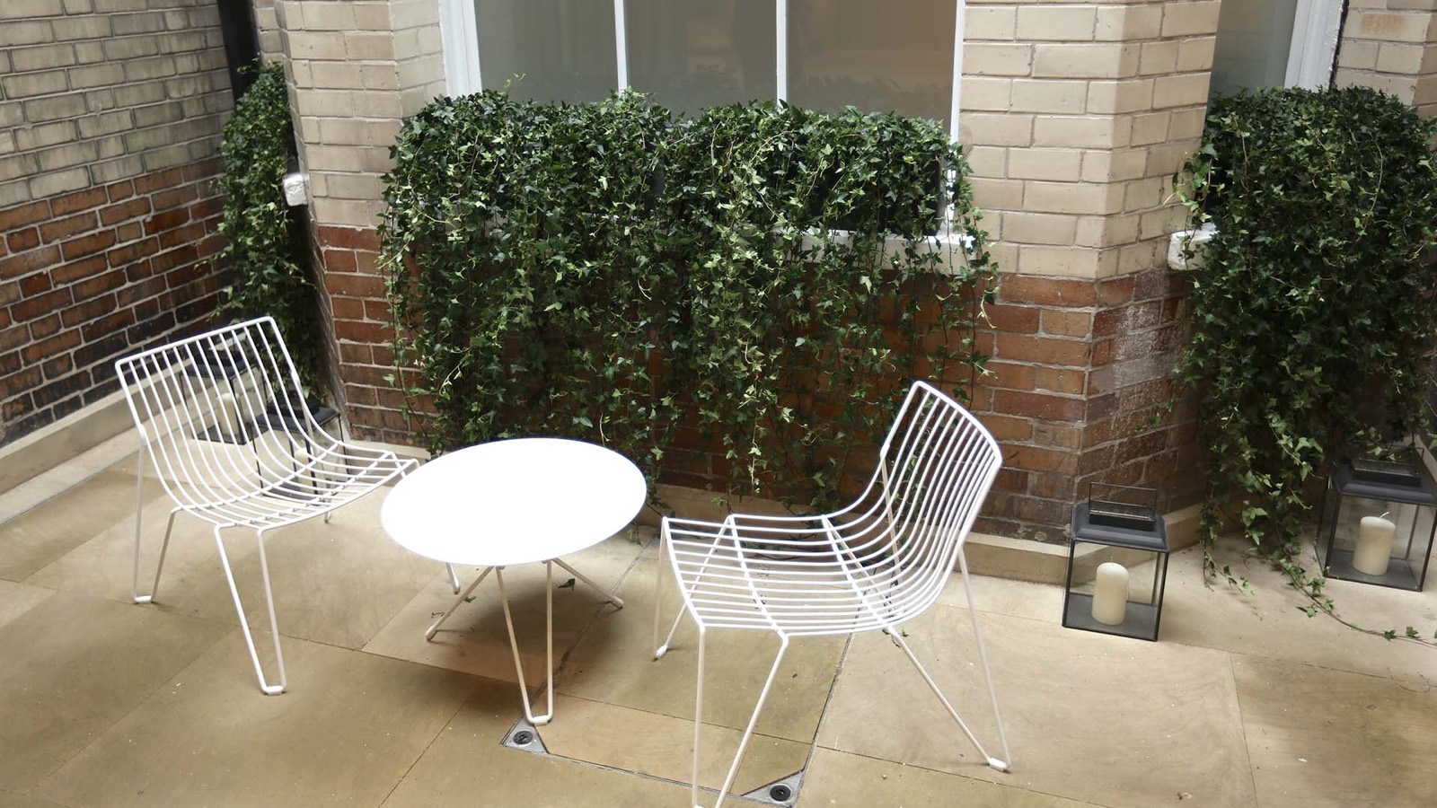 Private terrace with ivy-clad brick walls