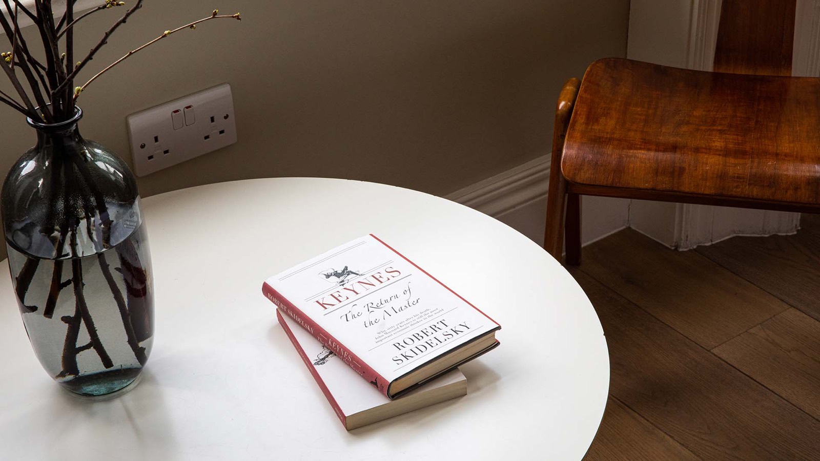 Books and cut branches on the side table