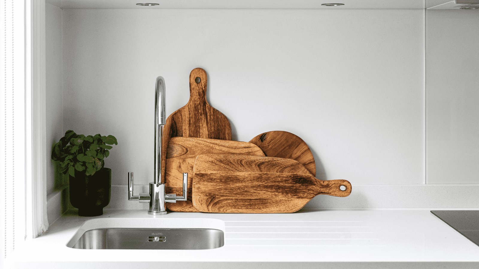 Chopping boards beside the kitchen sink