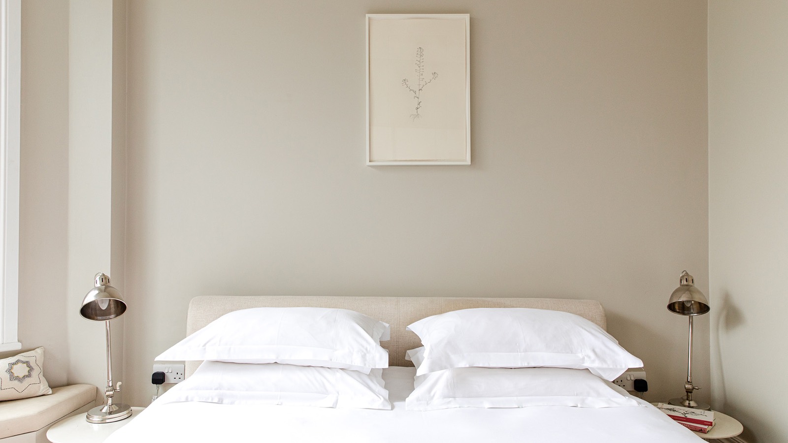 Bedroom dressed in white linen
