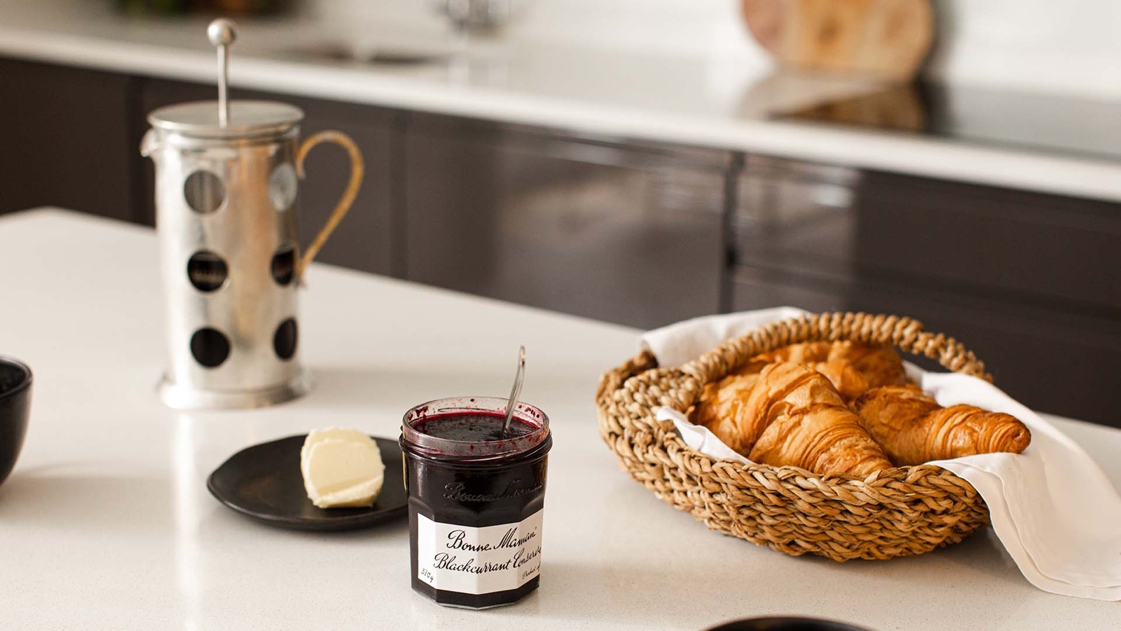 Cafetière and croissants on the island