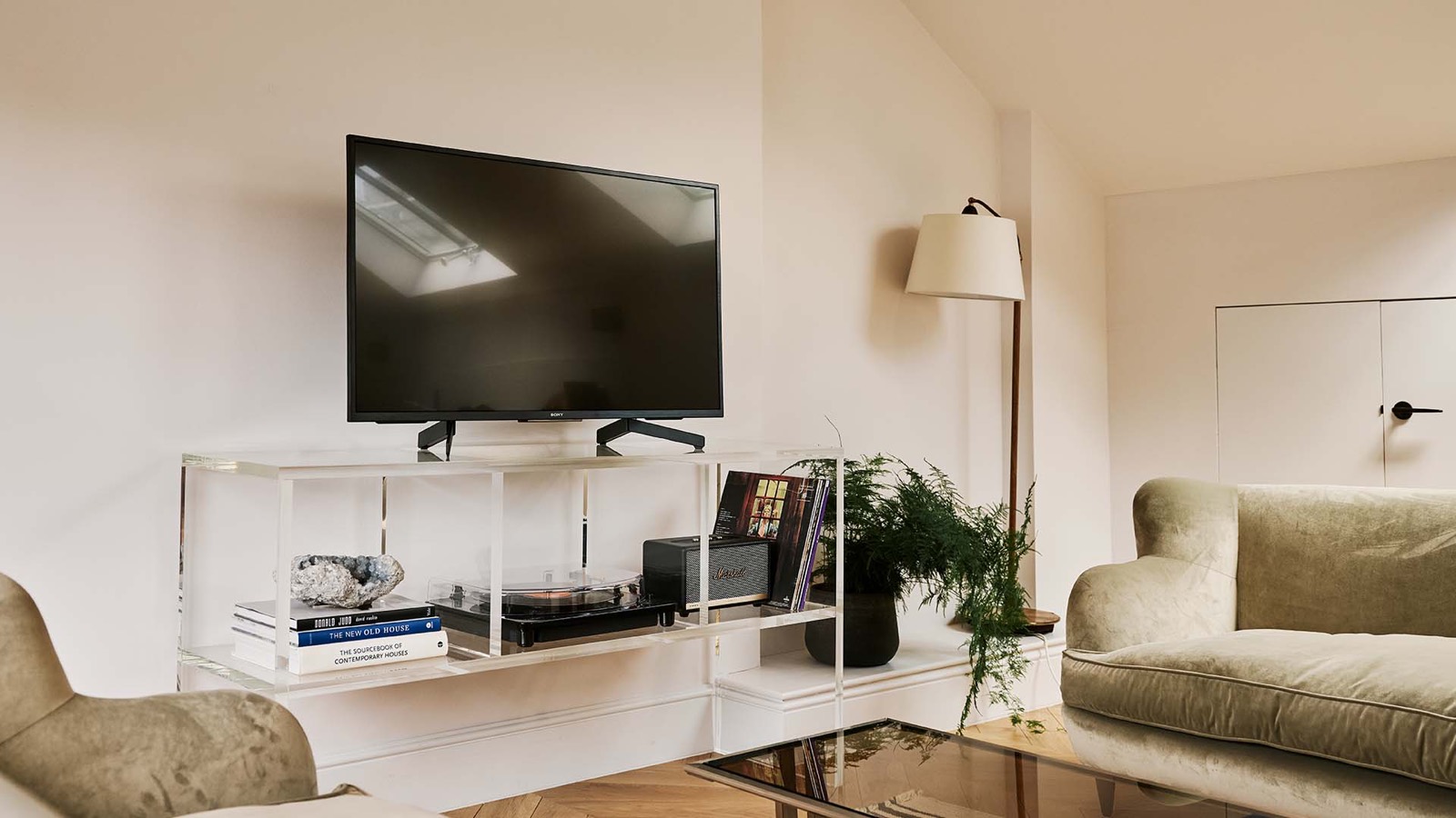 Turntable and record shelf beside the sofa