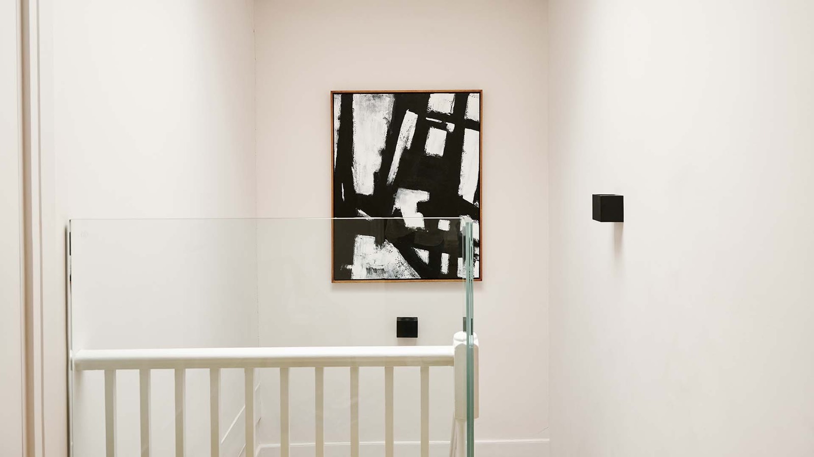Original staircase with artwork on the landing