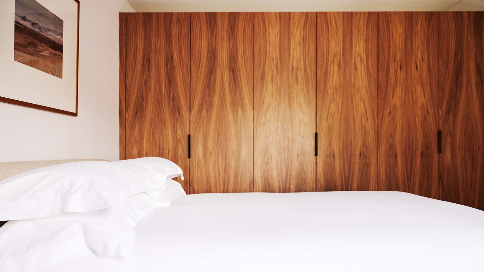 Principal bedroom with fitted walnut wardrobes