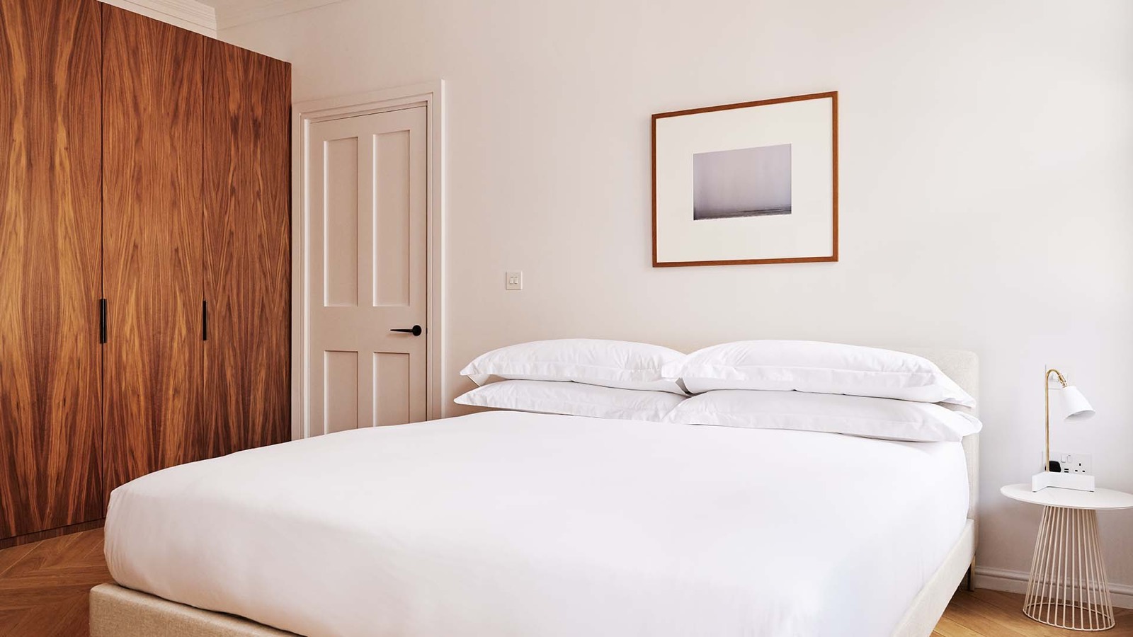 Bedroom with fitted walnut wardrobes