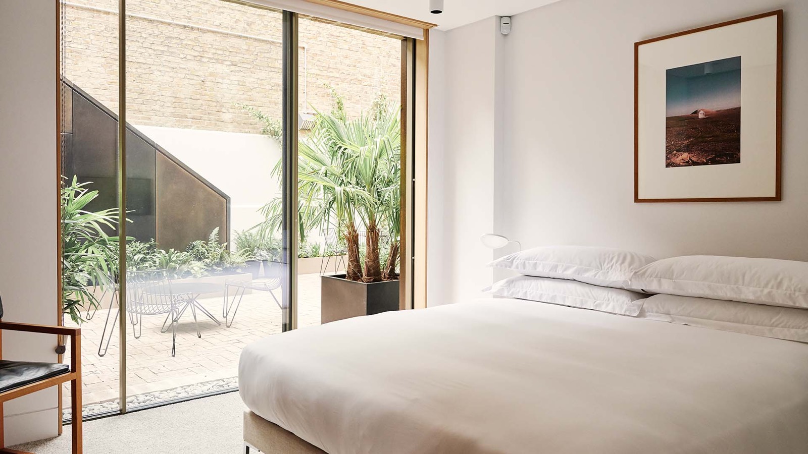 Bedroom with glazed doors onto the courtyard
