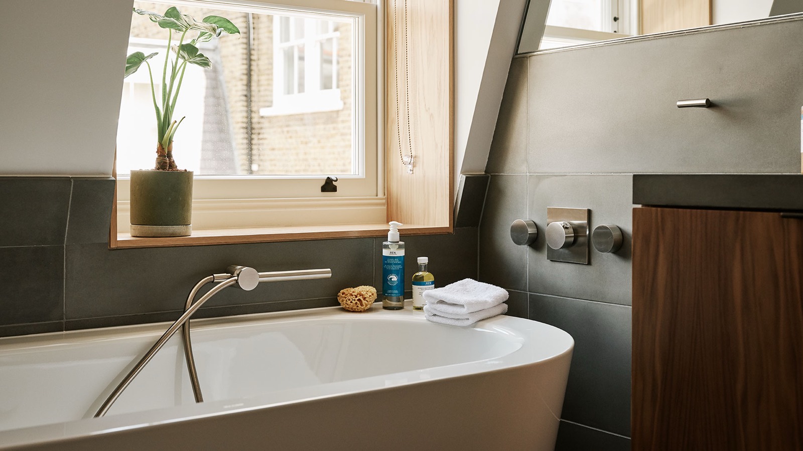 Bath set beneath the bathroom window
