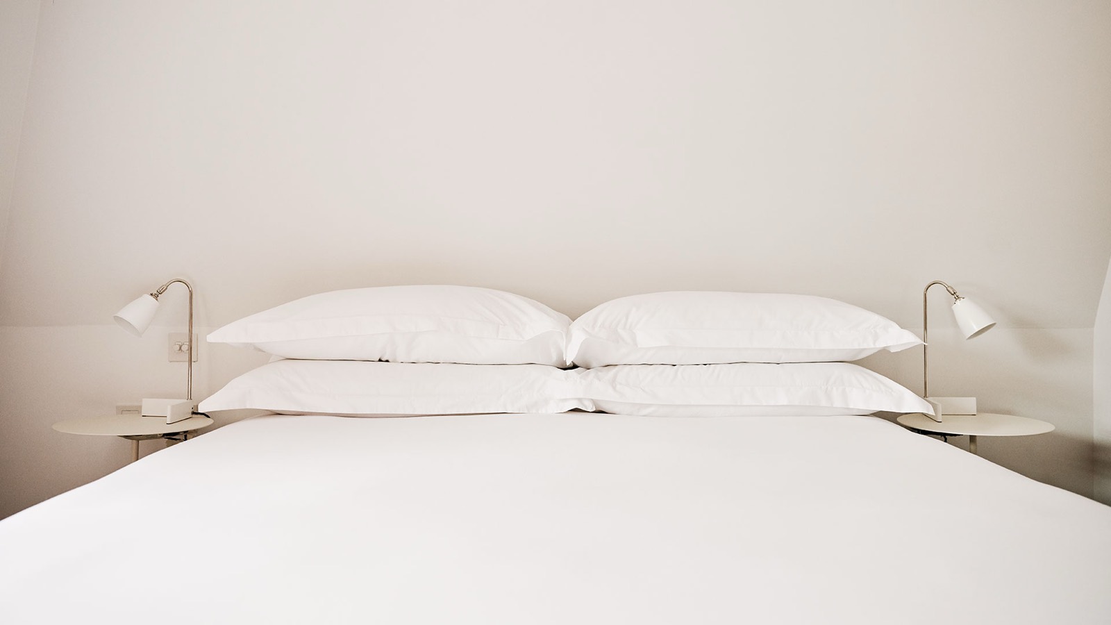 Bed made up in crisp white linen