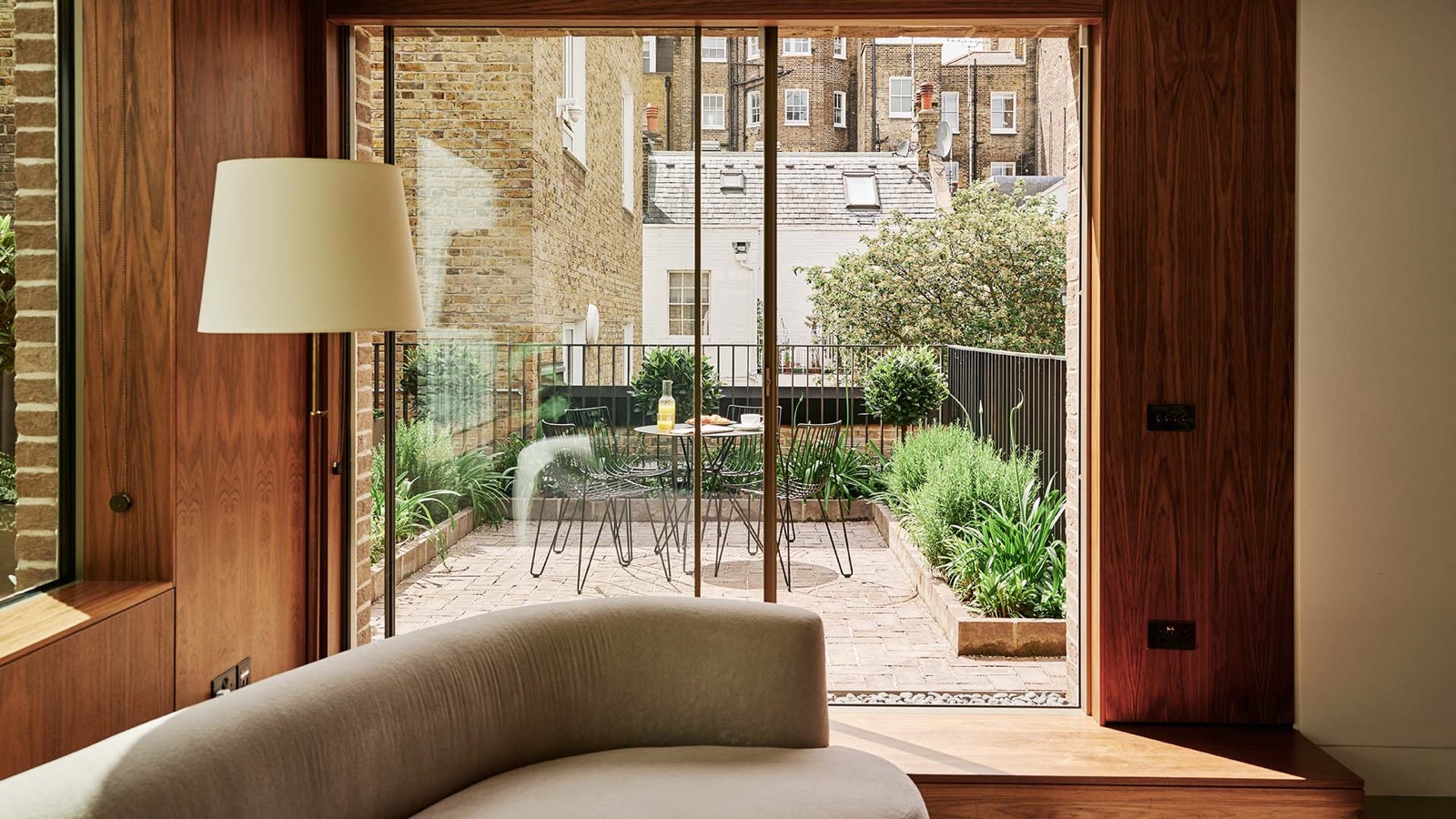 Sliding doors open to the planted terrace