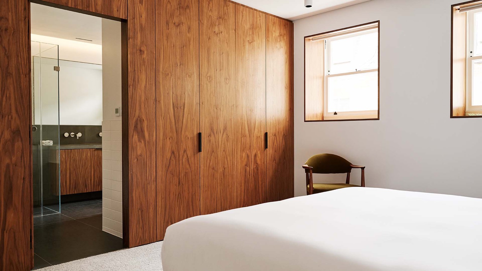 Principal bedroom with walnut wardrobes and ensuite