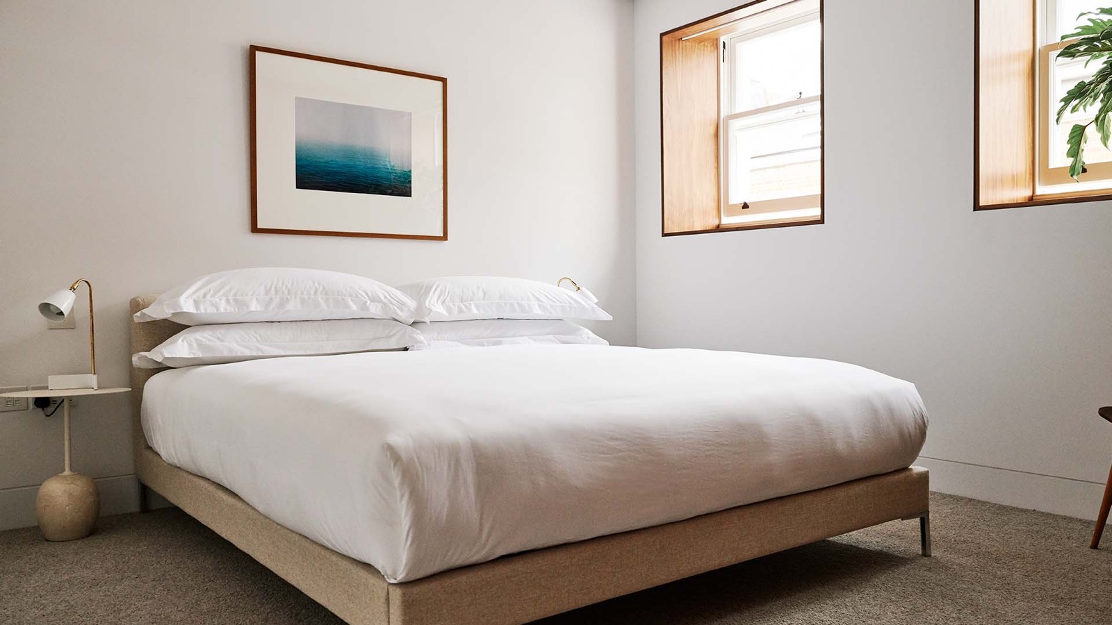 Bedroom with deep-set windows and soft carpet