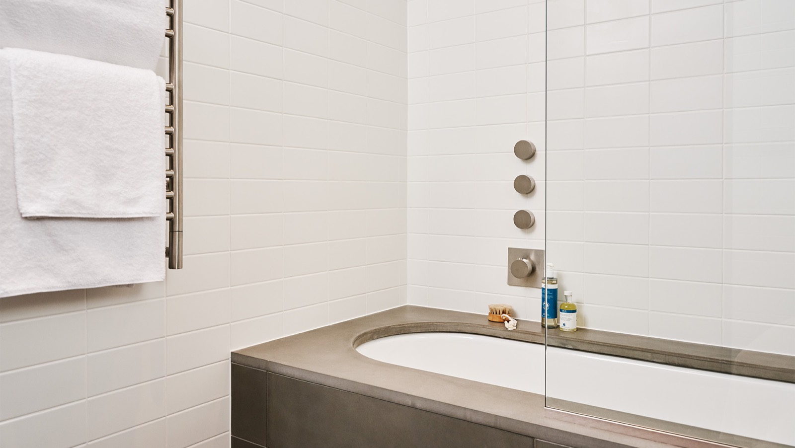 Bath with stone surround and heated towel rail